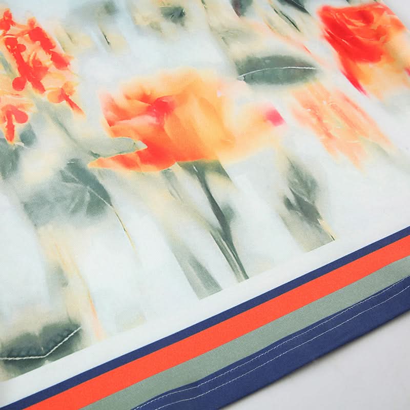 Effortless Chic: Watercolor Floral Mini Skirt with Stylish Striped Hem – Your Fall Transition Essential