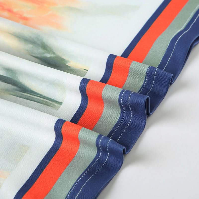 Effortless Chic: Watercolor Floral Mini Skirt with Stylish Striped Hem – Your Fall Transition Essential