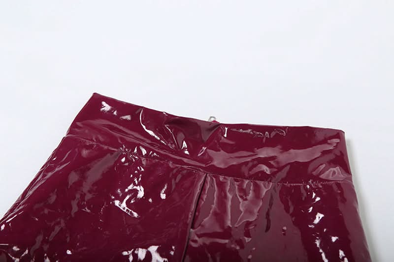 Unleash Your Inner Vixen: Sleek Burgundy Faux Leather Halter Jumpsuit for Fall & Halloween Glam