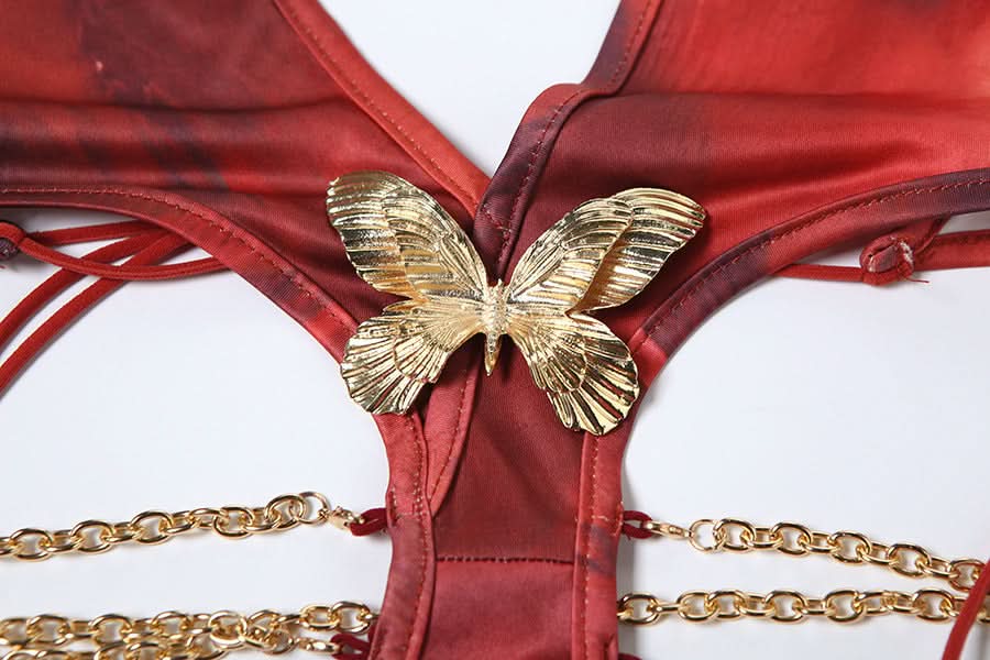 Fall Femme Fatale: Red Halter Cutout Maxi Dress with Gold Chain & Butterfly Detail