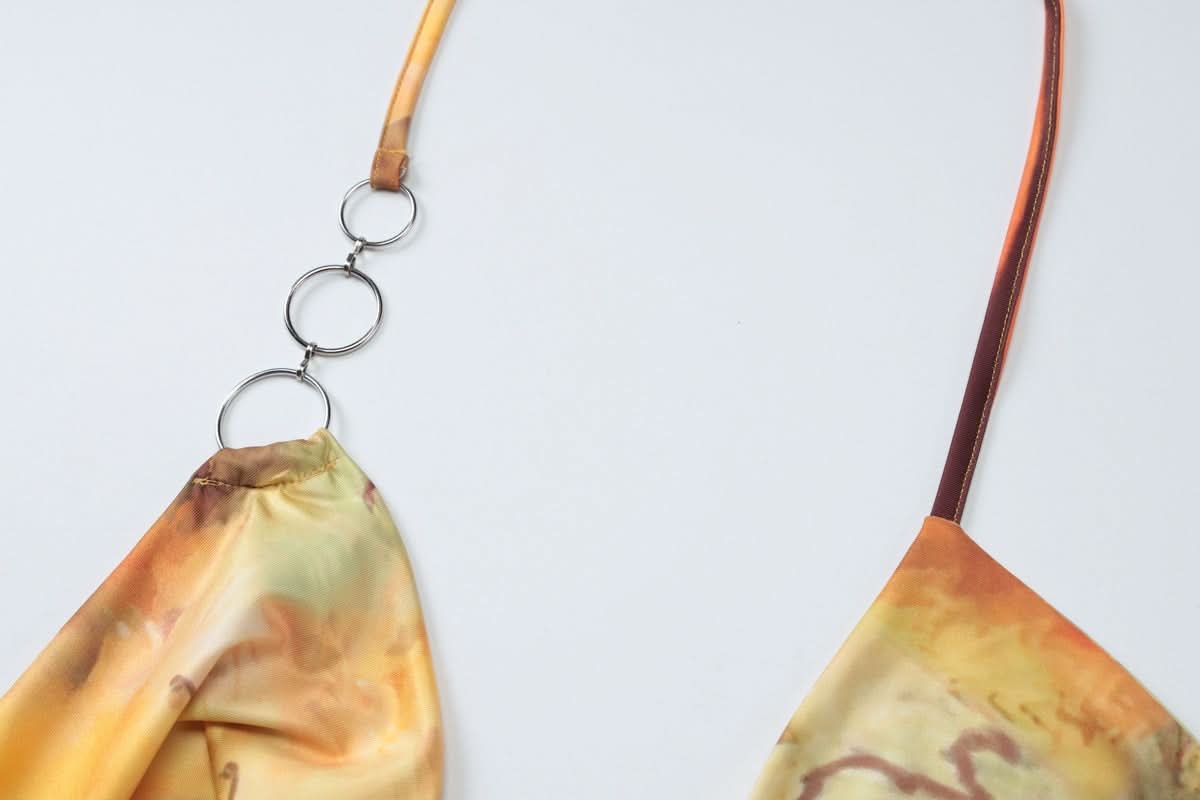 Sunset Serenade Halter Cutout Mini Dress - O-Ring Detail & Flowing Print for Fall Getaways