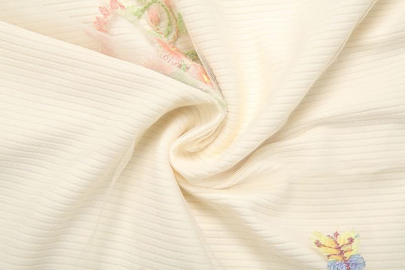 Whimsical Floral Embroidered Ribbed Mini Skirt with Sheer Ruffle Trim