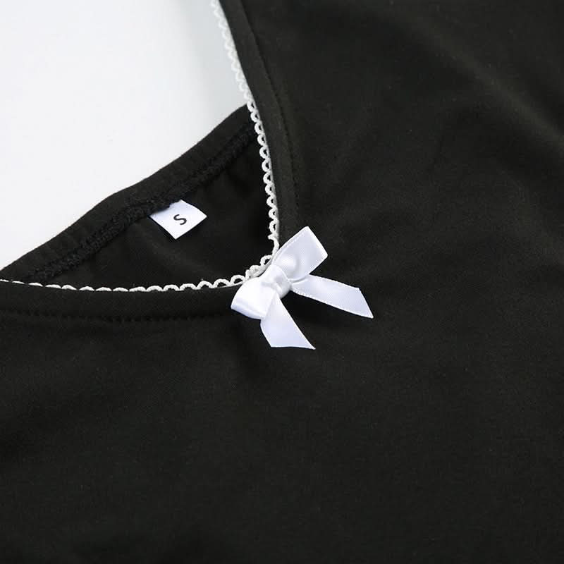 Coquette Chic: Black Bow-Detail Cutout Bodysuit - Fall's Must-Have Statement Piece