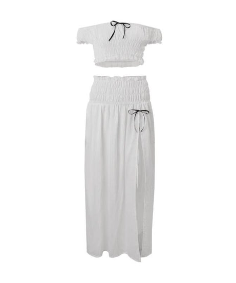 Effortless Resort Chic: White Smocked Off-Shoulder Crop Top & Slit Maxi Skirt Set with Bow Details | Your Winter Getaway Essential