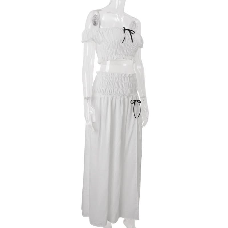 Effortless Resort Chic: White Smocked Off-Shoulder Crop Top & Slit Maxi Skirt Set with Bow Details | Your Winter Getaway Essential