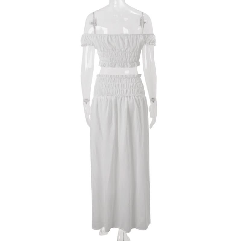Effortless Resort Chic: White Smocked Off-Shoulder Crop Top & Slit Maxi Skirt Set with Bow Details | Your Winter Getaway Essential