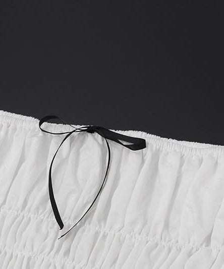 Effortless Resort Chic: White Smocked Off-Shoulder Crop Top & Slit Maxi Skirt Set with Bow Details | Your Winter Getaway Essential