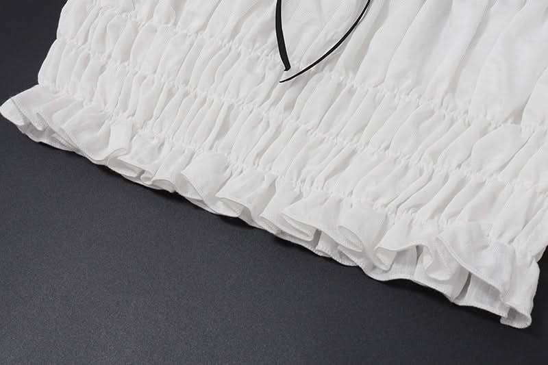 Effortless Resort Chic: White Smocked Off-Shoulder Crop Top & Slit Maxi Skirt Set with Bow Details | Your Winter Getaway Essential