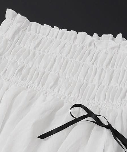 Effortless Resort Chic: White Smocked Off-Shoulder Crop Top & Slit Maxi Skirt Set with Bow Details | Your Winter Getaway Essential