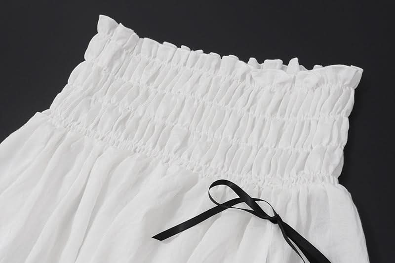 Effortless Resort Chic: White Smocked Off-Shoulder Crop Top & Slit Maxi Skirt Set with Bow Details | Your Winter Getaway Essential