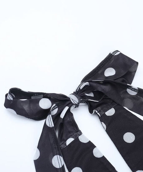 Retro Chic Polka Dot Halter Mini Dress: Flirty Ruched Style with Daisy Accents