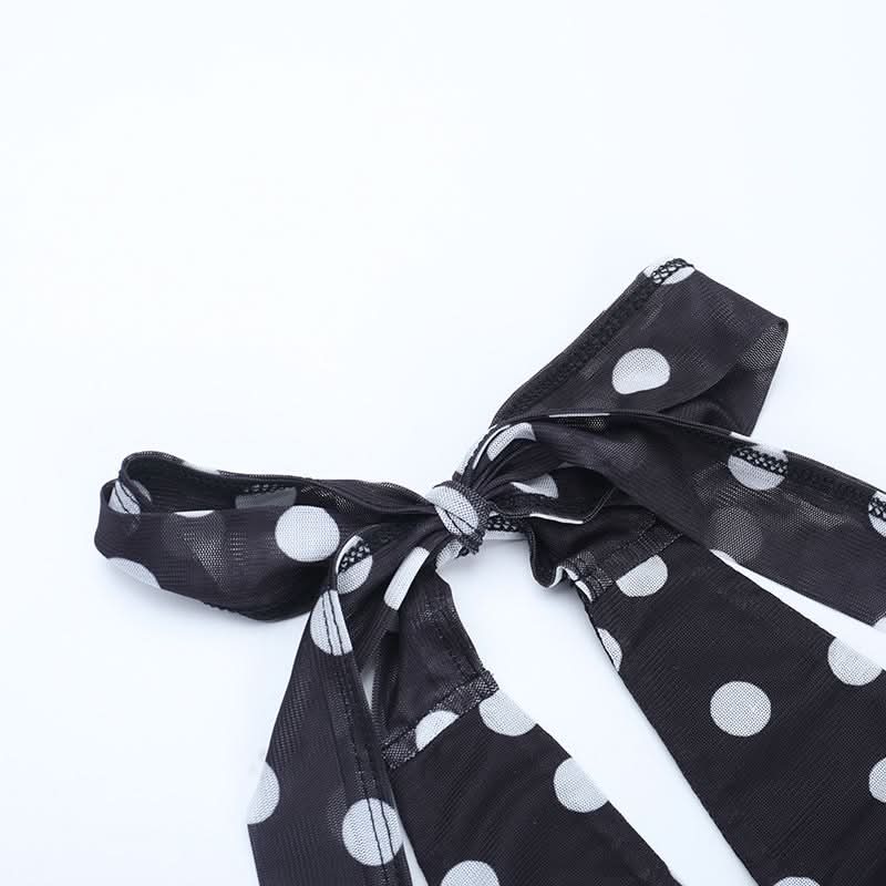 Retro Chic Polka Dot Halter Mini Dress: Flirty Ruched Style with Daisy Accents