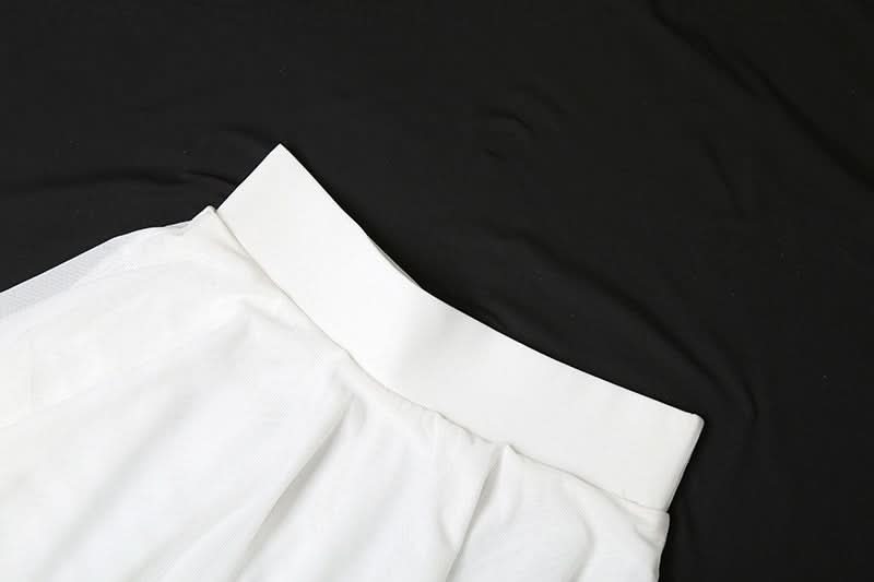 Ethereal Winter White Tiered Maxi Skirt - Chic High-Low Ruffles for Holiday & Resort Glam