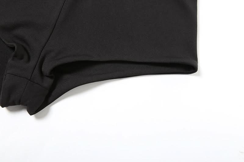 Fall's Edgy Obsession: Studded Low-Rise Shorts with Cascading Strap