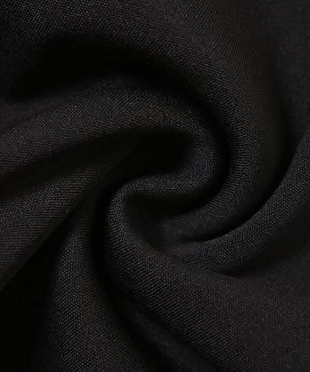 Fall's Edgy Obsession: Studded Low-Rise Shorts with Cascading Strap