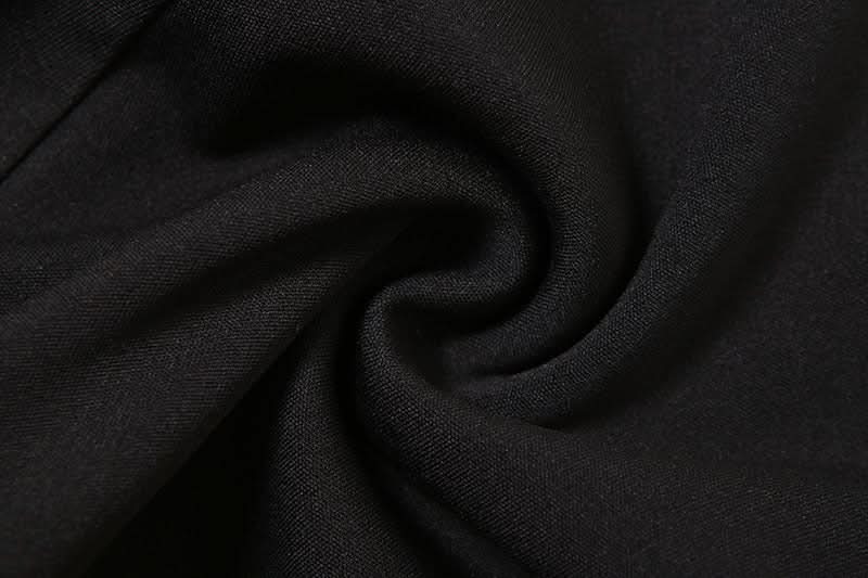 Fall's Edgy Obsession: Studded Low-Rise Shorts with Cascading Strap