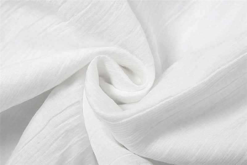 Ethereal White Halter Maxi Dress: Your Chic Escape for Fall & Winter Getaways