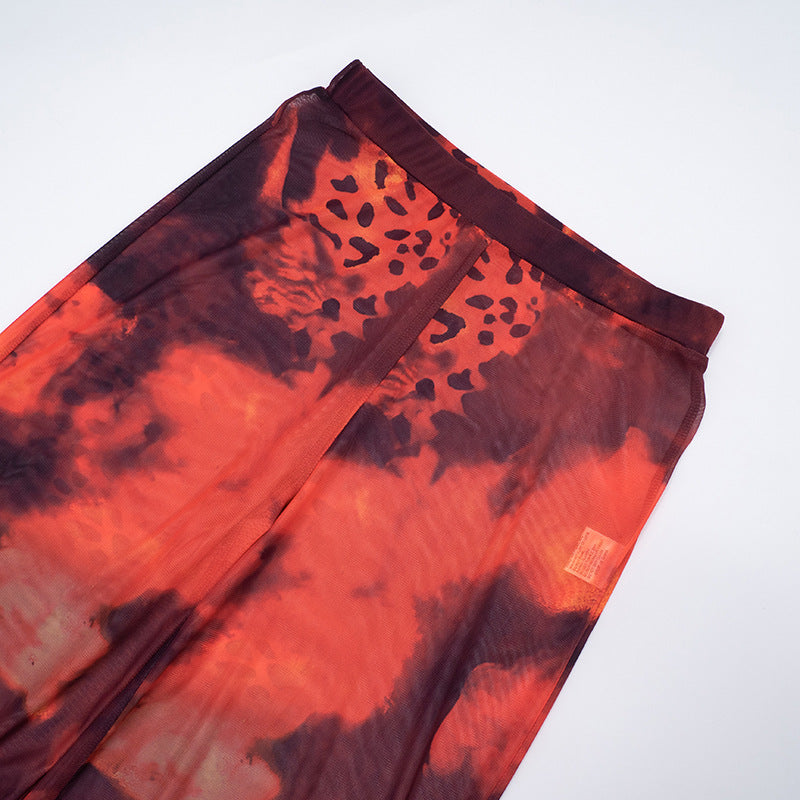 Ignite Y2K Vibes: Red & Black Leopard Mesh Flare Pants - Sheer Statement for Fall Parties & Halloween