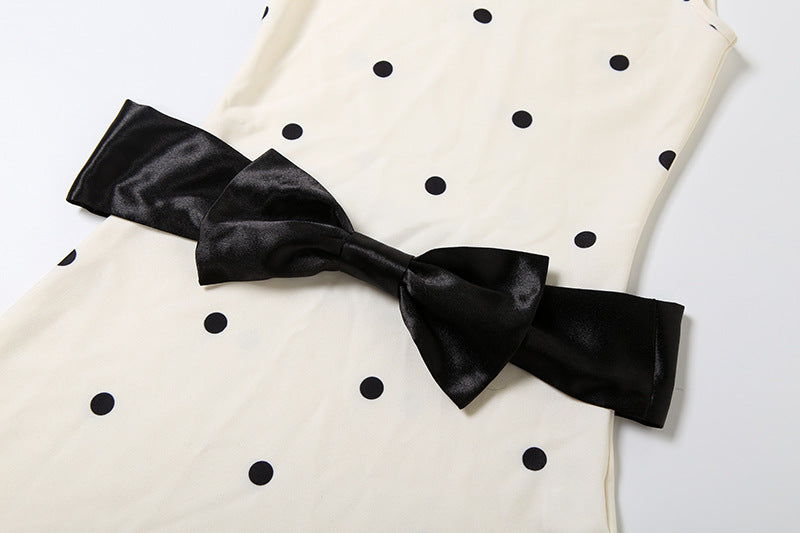 Holiday Glam: Chic Polka Dot Mock Neck Mini Dress with Statement Bow