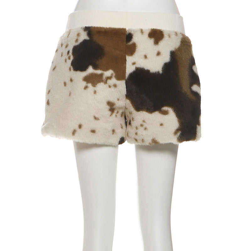 Untamed Chic: Faux Fur Cow Print Medium Rise Shorts – Your Cozy Fall & Holiday Statement Piece