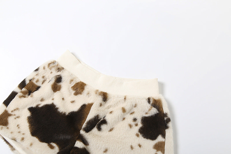 Untamed Chic: Faux Fur Cow Print Medium Rise Shorts – Your Cozy Fall & Holiday Statement Piece