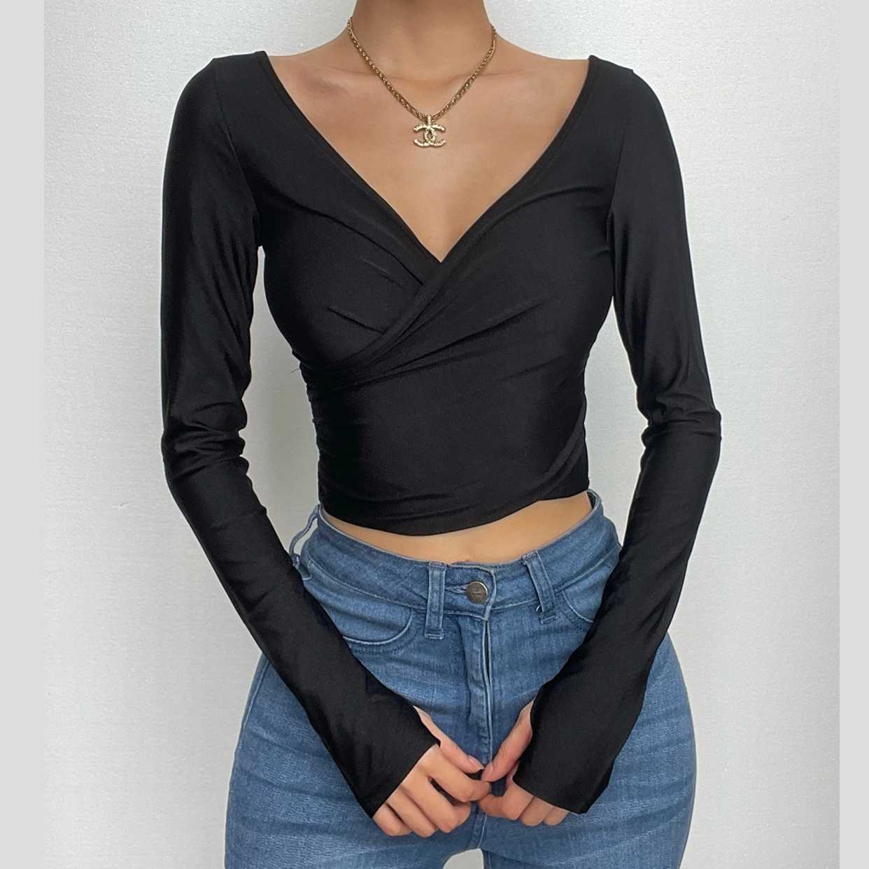 Chic Fall Essential: Black Wrap V-Neck Long Sleeve Crop Top with Thumbholes