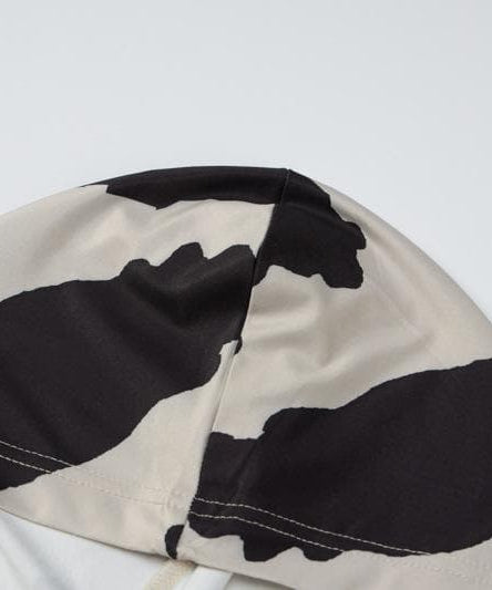 Fall Trend Alert: Cow Print Mock Neck Long Sleeve Bodycon Midi Dress with Asymmetrical Hem