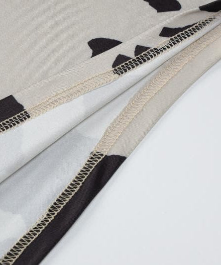 Fall Trend Alert: Cow Print Mock Neck Long Sleeve Bodycon Midi Dress with Asymmetrical Hem