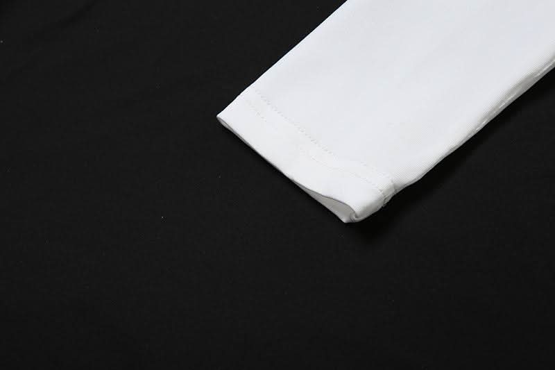 Autumn Glam: Chic White Long Sleeve Ruched Mini Dress - Knot Front & Ruffle Details