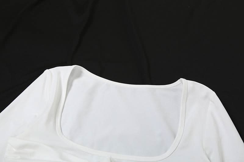 Autumn Glam: Chic White Long Sleeve Ruched Mini Dress - Knot Front & Ruffle Details