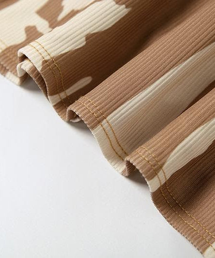 Edgy Fall Nights: Abstract Print Halter Cut-Out Mini Dress with Cold Shoulder Sleeves